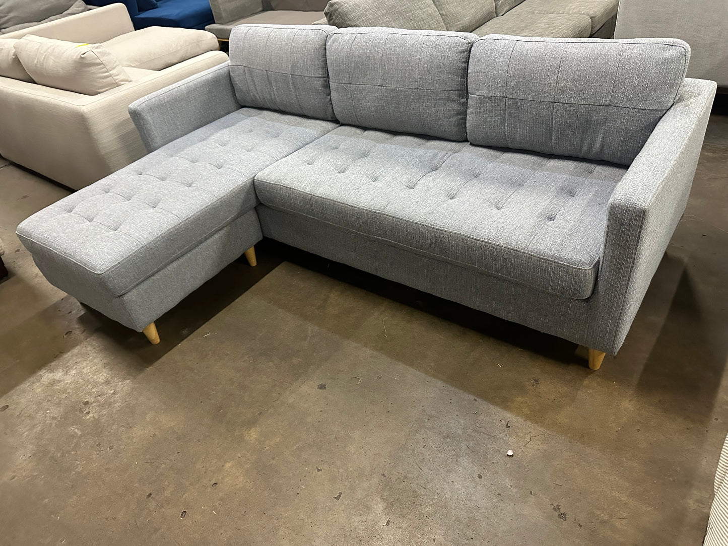 Light blue color reversible chaise L shape Sofa (Pre-Owned). Perfect as new lounge lovers brand