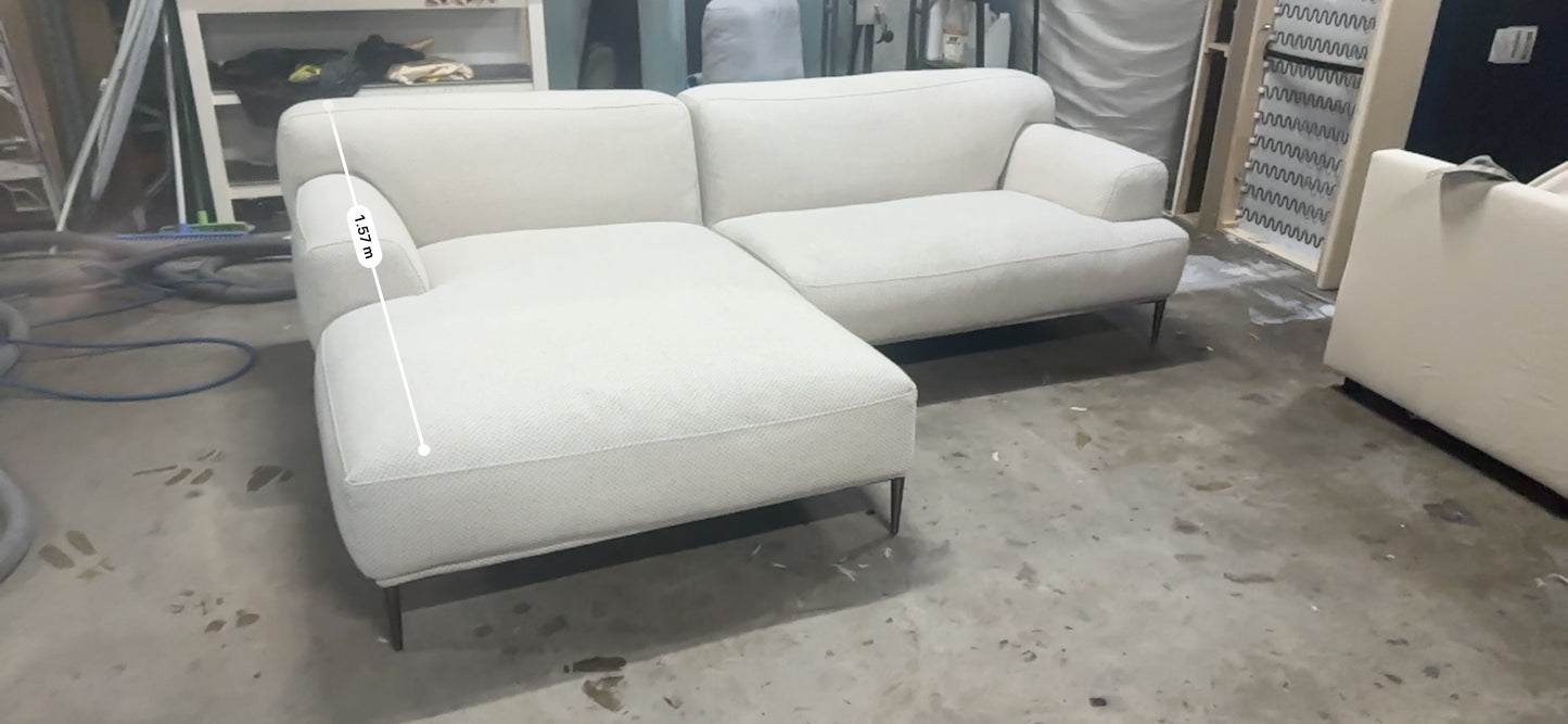 Cream color L shape sofa. Brosa brand