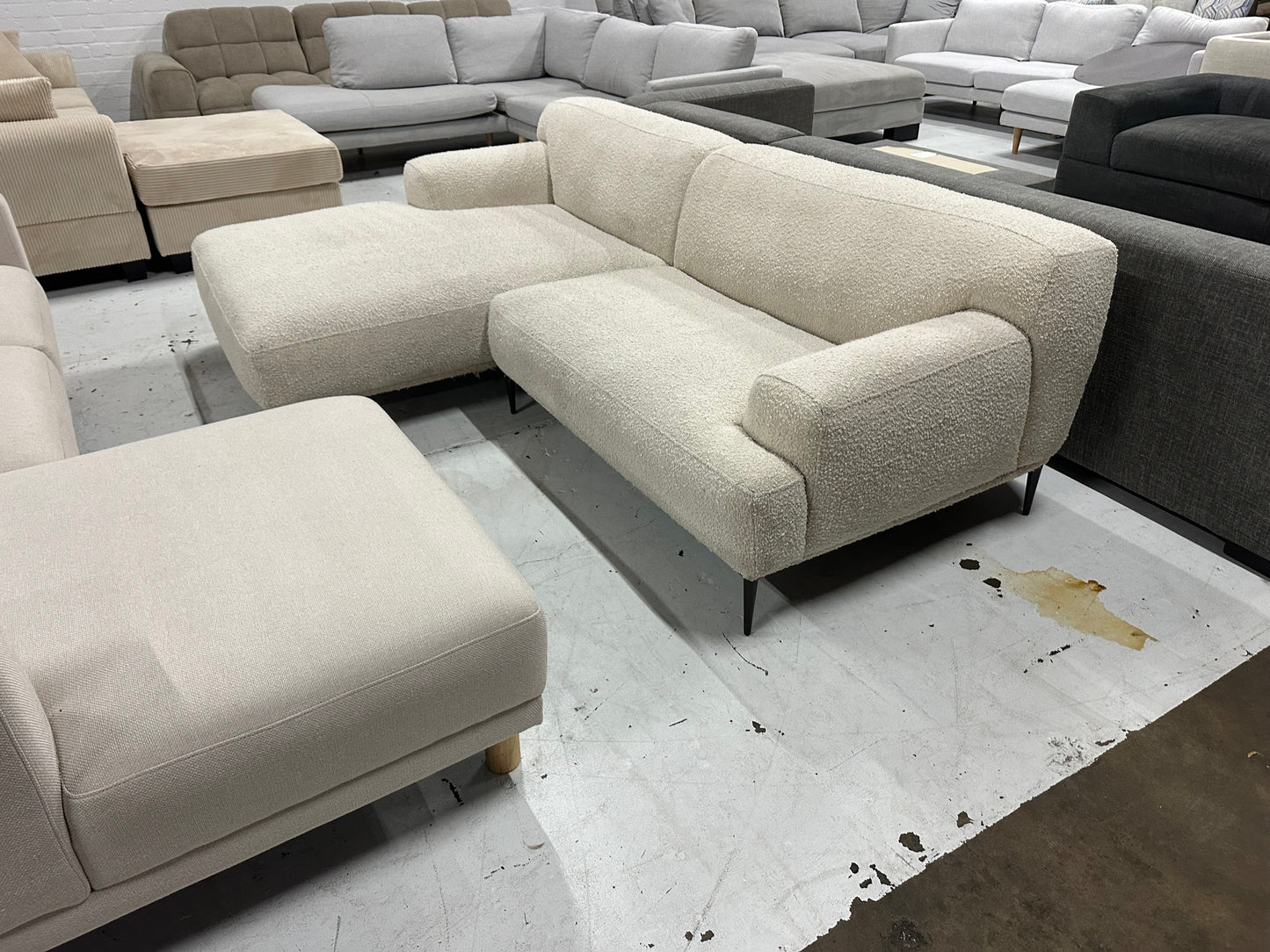 Cream color Boucle L shape sofa. Brosa brand