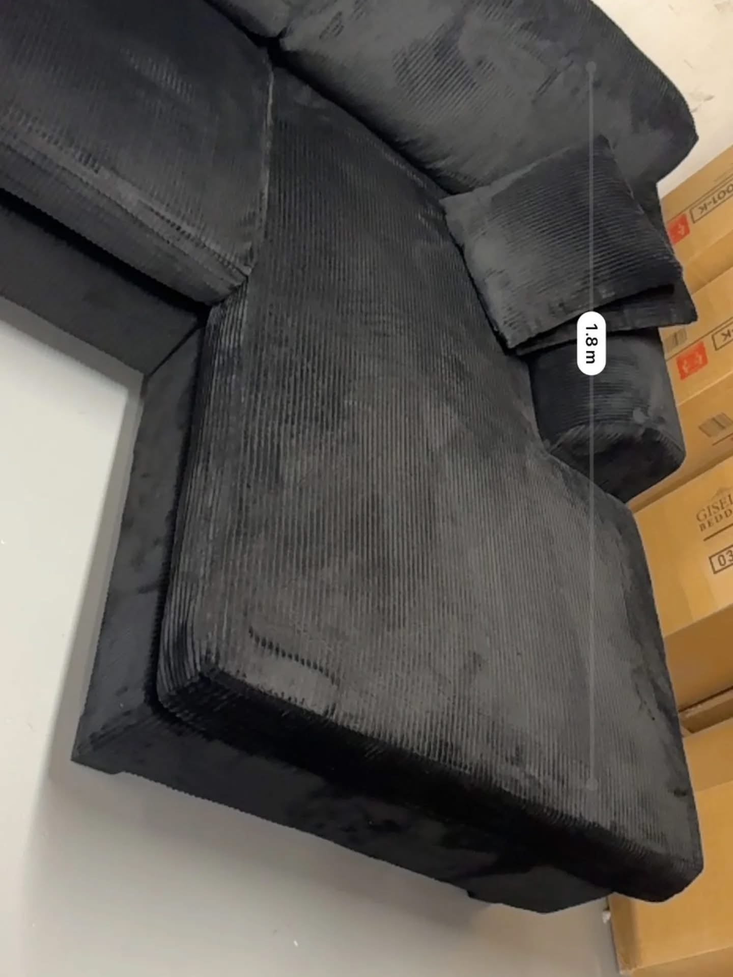 Noosa Corduroy Sofa. Black color reversible chaise.