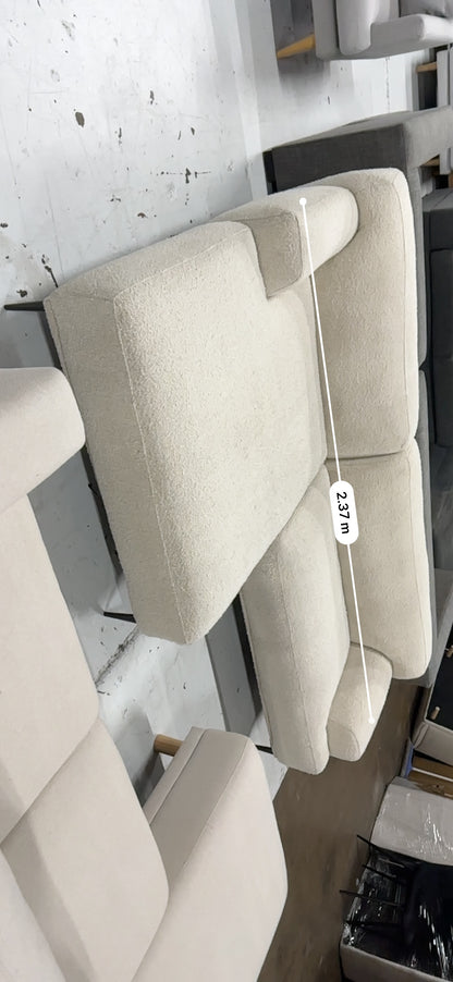 Cream color Boucle L shape sofa. Brosa brand