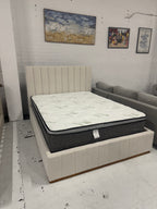 Cream color corduroy sofa and cream bed frame with mattress