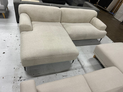 Cream color Boucle L shape sofa. Brosa brand