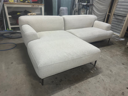 Cream color L shape sofa. Brosa brand