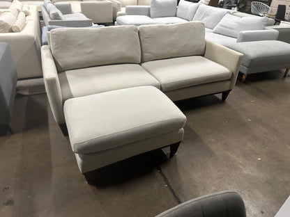 Affordable light grey color 2.5 seater and matching ottoman.
