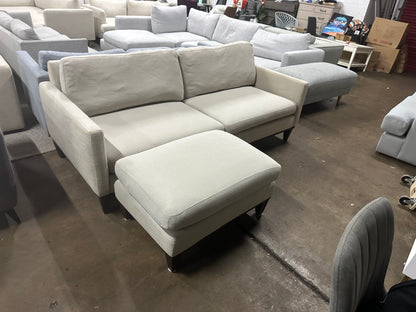 Affordable light grey color 2.5 seater and matching ottoman.