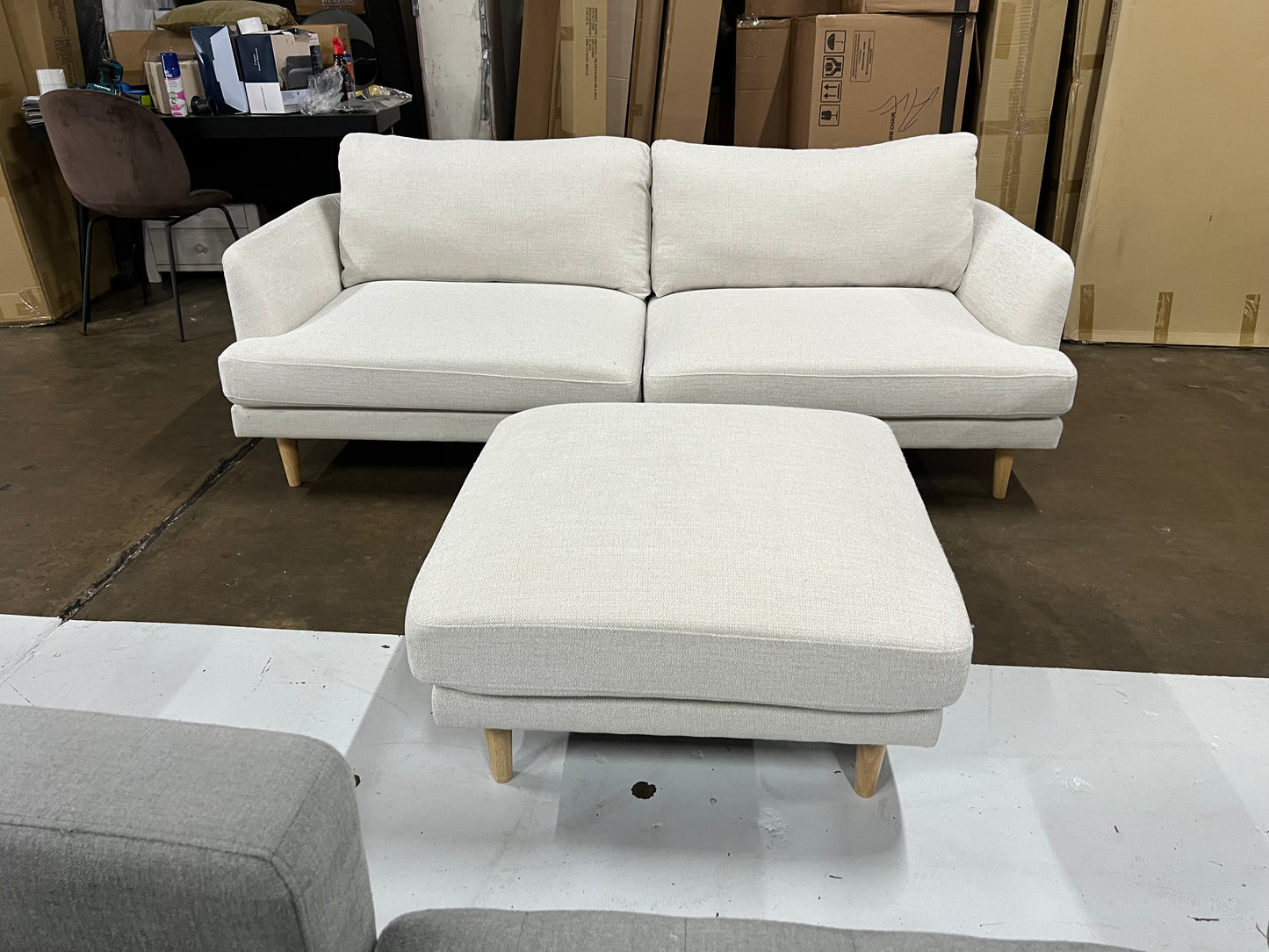 Lounge Lover's Sofa (Pre-Owned) cream color 2.5 seater with a matching ottoman.
