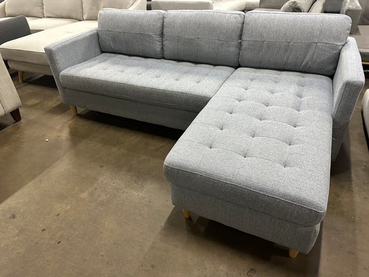 Light blue color reversible chaise L shape Sofa (Pre-Owned). Perfect as new lounge lovers brand