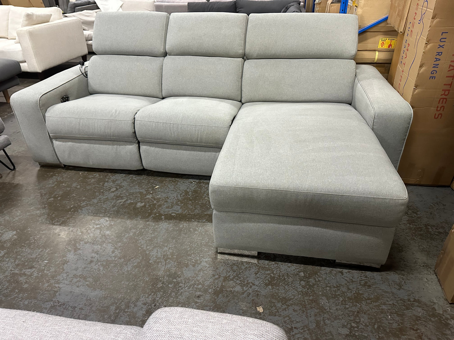 Nick Sclai Beautiful couch with super comfy seats. Light grey color. With electric recliner