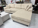 Cream color corduroy sofa and cream bed frame with mattress