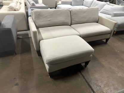 Affordable light grey color 2.5 seater and matching ottoman.