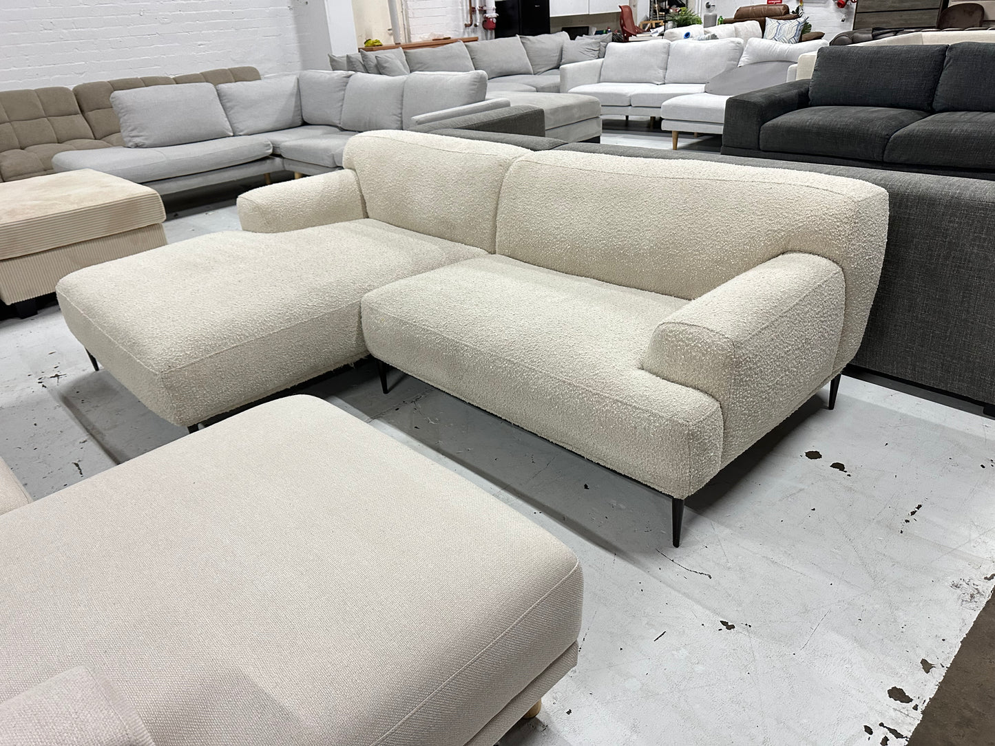 Cream color Boucle L shape sofa. Brosa brand