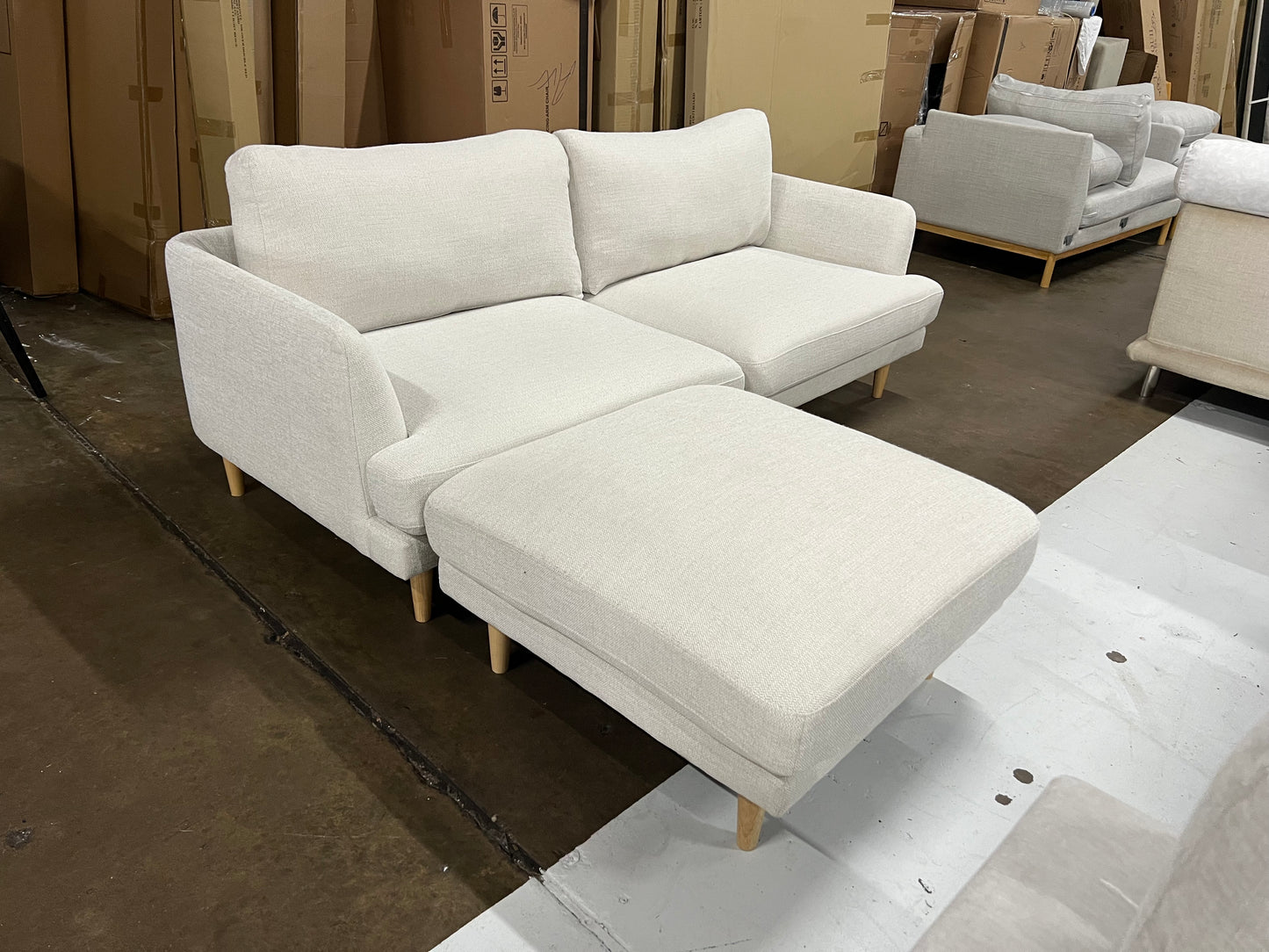 Lounge Lover's Sofa (Pre-Owned) cream color 2.5 seater with a matching ottoman.