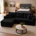 Black color corduroy sofa and cream bed frame with mattress